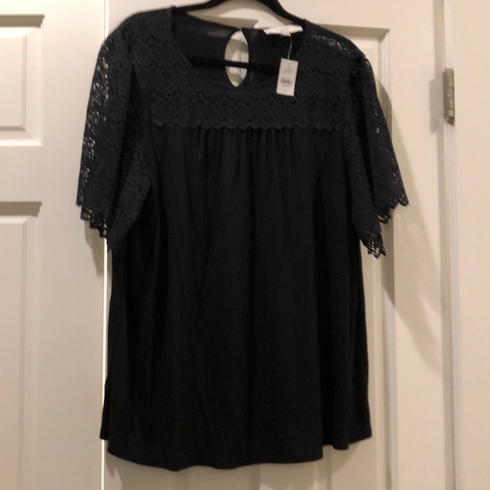 Black, lace yoke top with flutter sleeves.